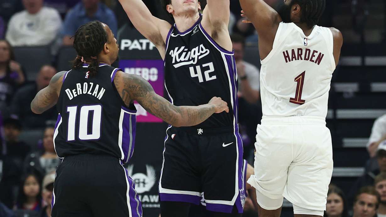 Cleveland Cavaliers guard James Harden (1) attempts to pass over Sacramento Kings center Maxime Raynaud (42) during the first half of an NBA basketball game Saturday, Feb. 7, 2026, in Sacramento, Calif.