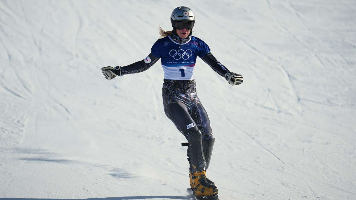 Czechia's Ester Ledecka reacts after finishing behind Austria's Sabine Payer during the women's snowboarding parallel giant slalom finals at the 2026 Winter Olympics, in Livigno, Italy, Sunday, Feb. 8, 2026.