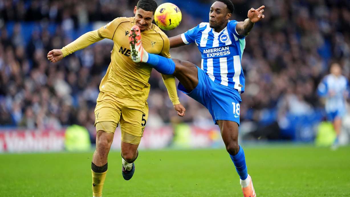 Brighton and Hove Albion's Danny Welbeck, right, and Crystal Palace's Maxence Lacroix in action during their English Premier League soccer match in Brighton, England, Sunday, Feb. 8, 2026.