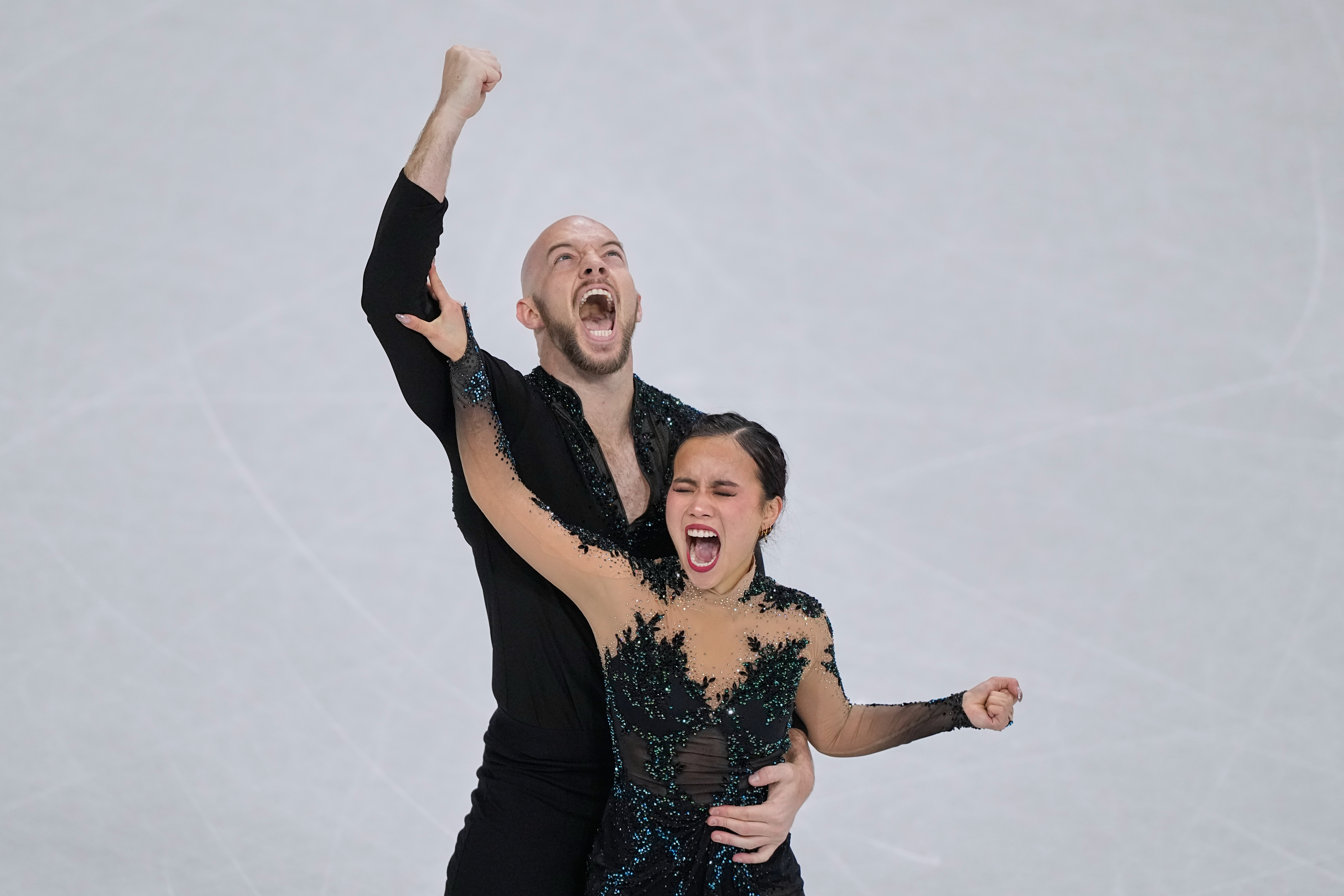 Ellie Kam and Danny O'Shea of the United States compete during the figure skating pairs team event at the 2026 Winter Olympics, in Milan, Italy, Sunday, Feb. 8, 2026. 