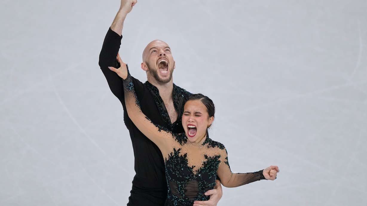 Ellie Kam and Danny O'Shea of the United States compete during the figure skating pairs team event at the 2026 Winter Olympics, in Milan, Italy, Sunday, Feb. 8, 2026.