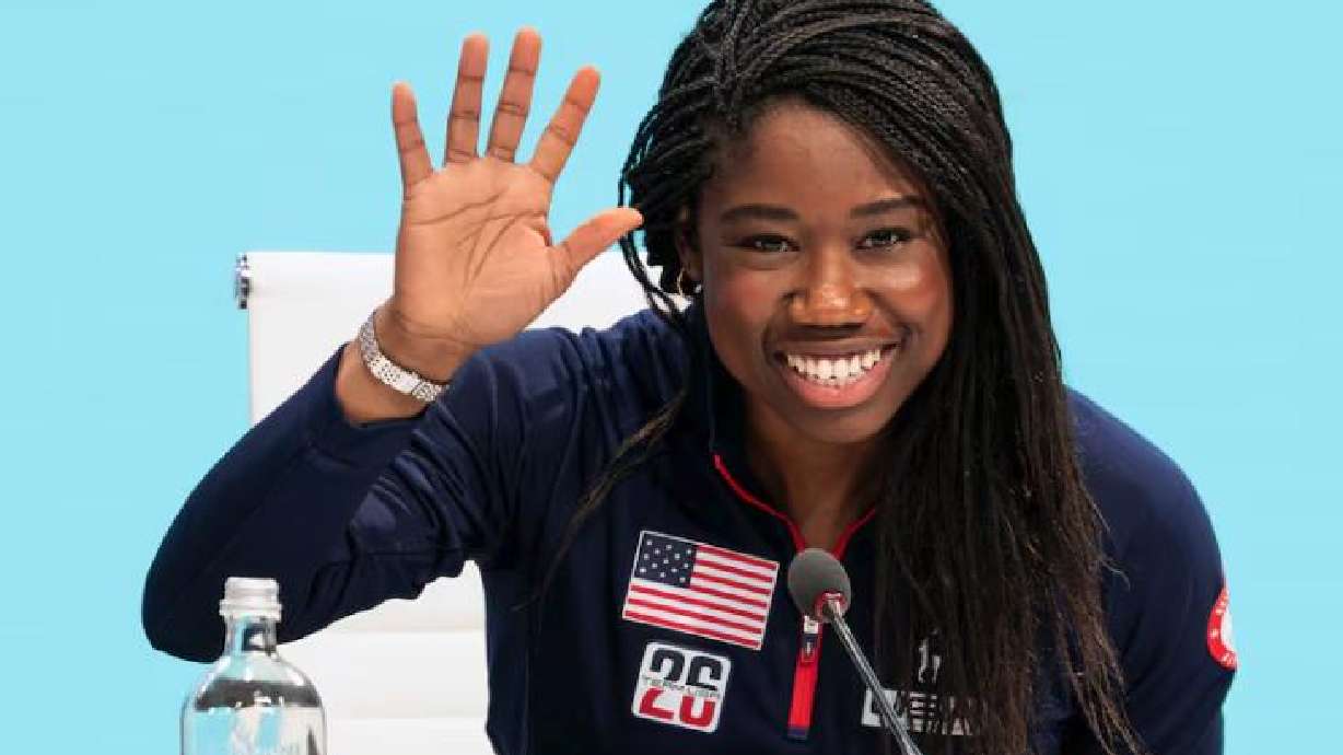 Speedskater Erin Jackson waves after speaking during Utah’s presentation to the IOC in Milan, Italy, on Tuesday.