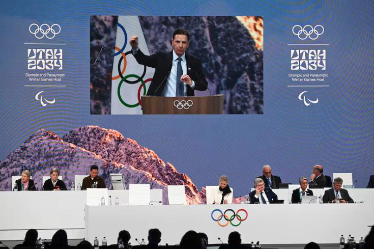 Fraser Bullock, executive chair and president of Olympic Winter Games Utah 2034, speaks during Utah’s presentation to the IOC in Milan on Tuesday.
