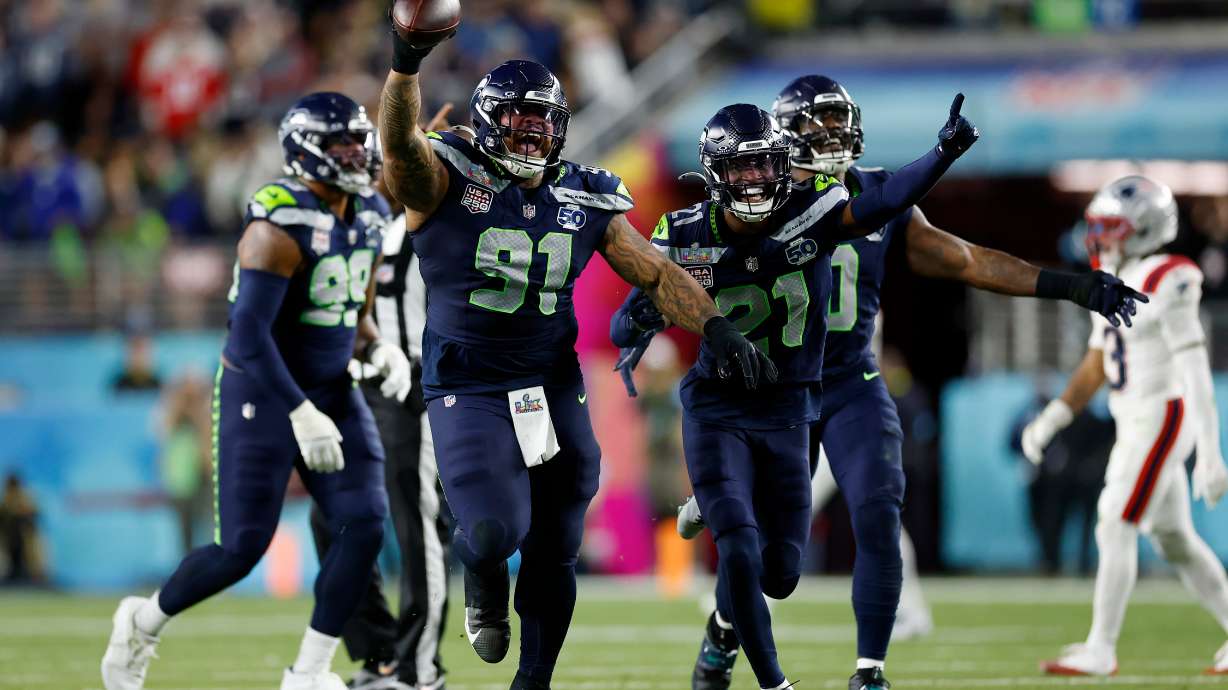 Seattle Seahawks Byron Murphy II (91), Devon Witherspoon (21), and the Seahawks defense celebrate after Murphy recovered a fumble after a sack during the third quarter of Super Bowl 60 in Santa Clara, Calif., Sunday, Feb. 8, 2026.