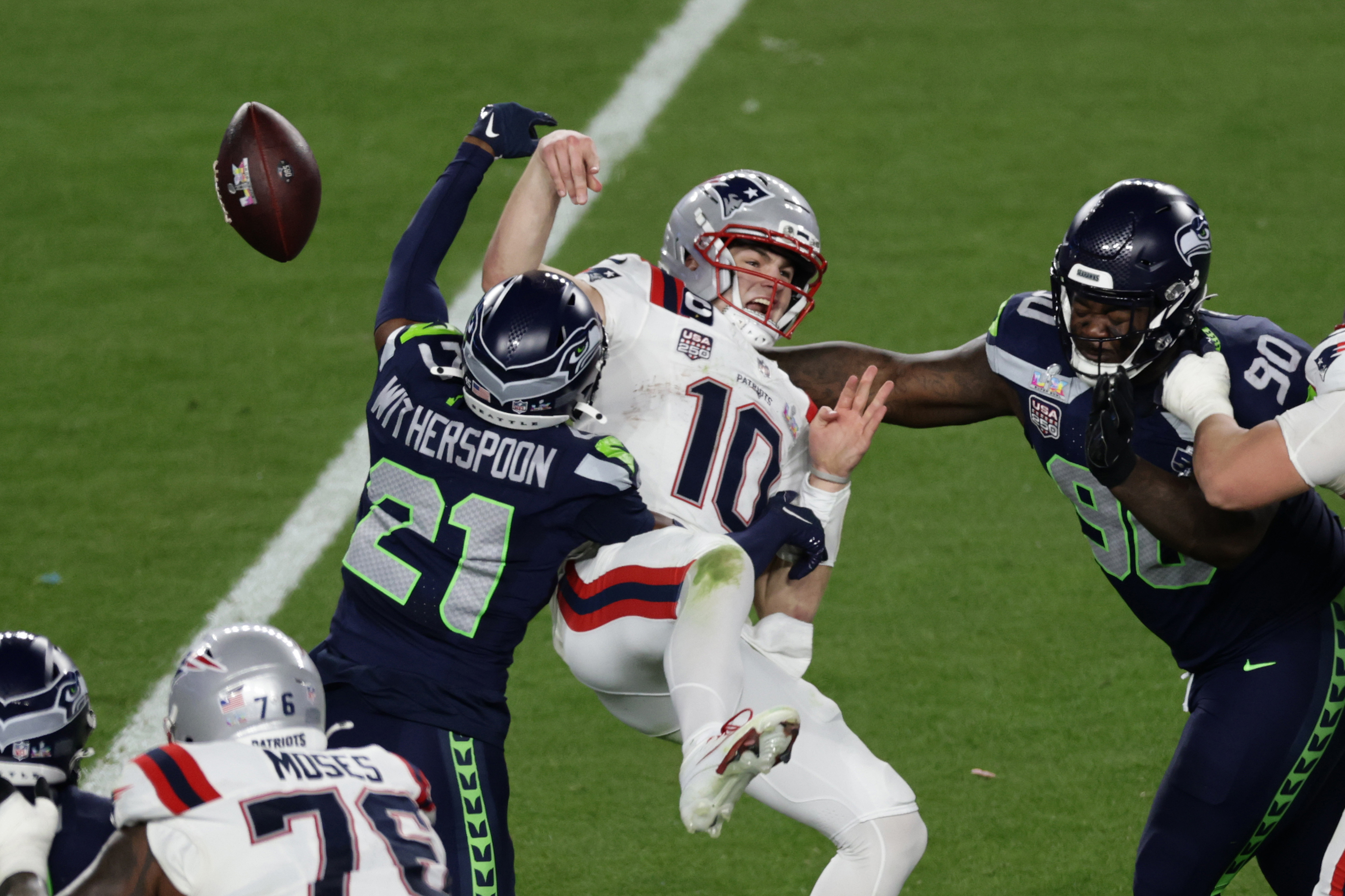 Seattle Seahawks cornerback Devon Witherspoon (21) forces a fumble against New England Patriots quarterback Drake Maye (10) at the NFL Super Bowl 60 game in Santa Clara, Calif., Sunday, February 8, 2026. 