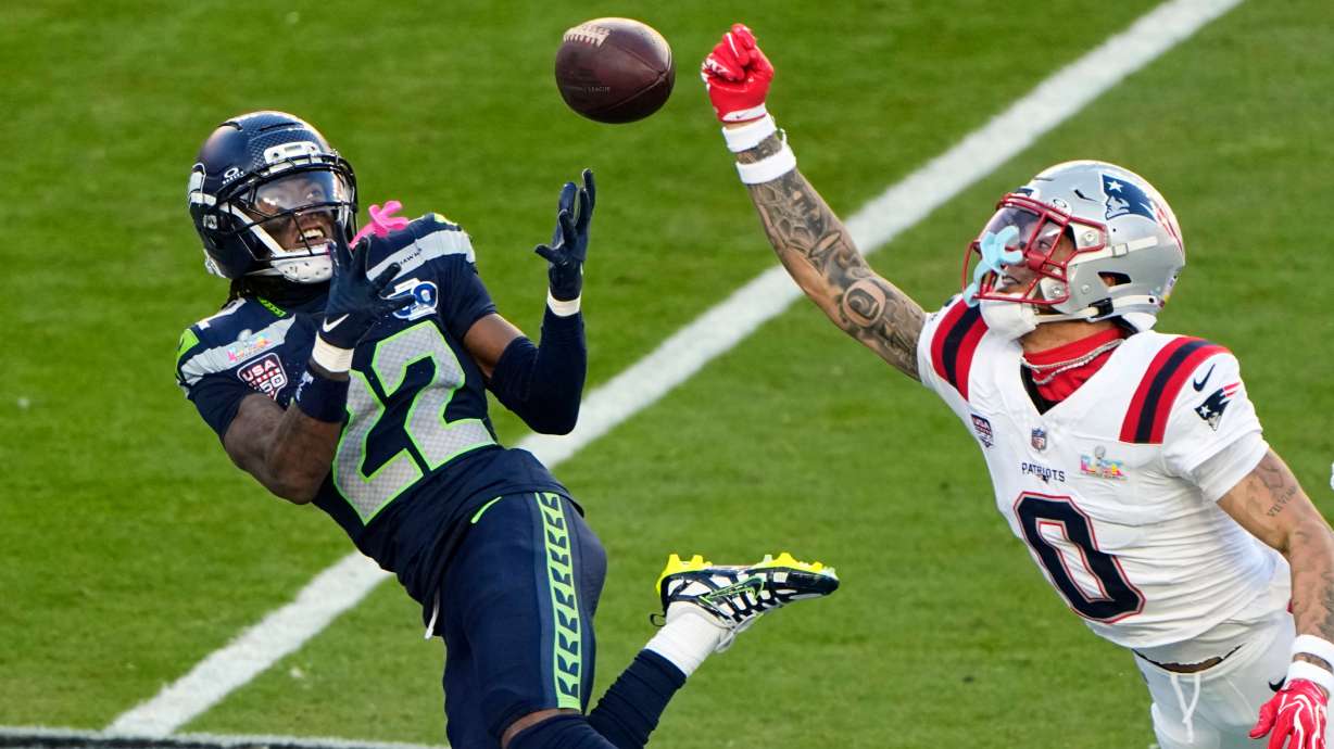 New England Patriots cornerback Christian Gonzalez (0) breaks up a pass intended for Seattle Seahawks wide receiver Rashid Shaheed (22) during the first half of the NFL Super Bowl 60 football game, Sunday, Feb. 8, 2026, in Santa Clara, Calif.