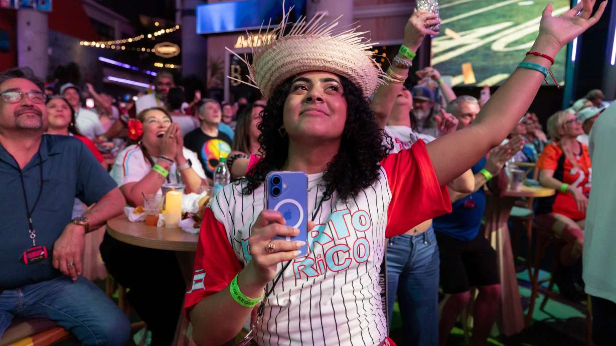 Fans in San Juan, Puerto Rico, watch Bad Bunny's performance on television during the halftime show of the NFL Super Bowl 60 football game Sunday, Feb. 8, 2026.