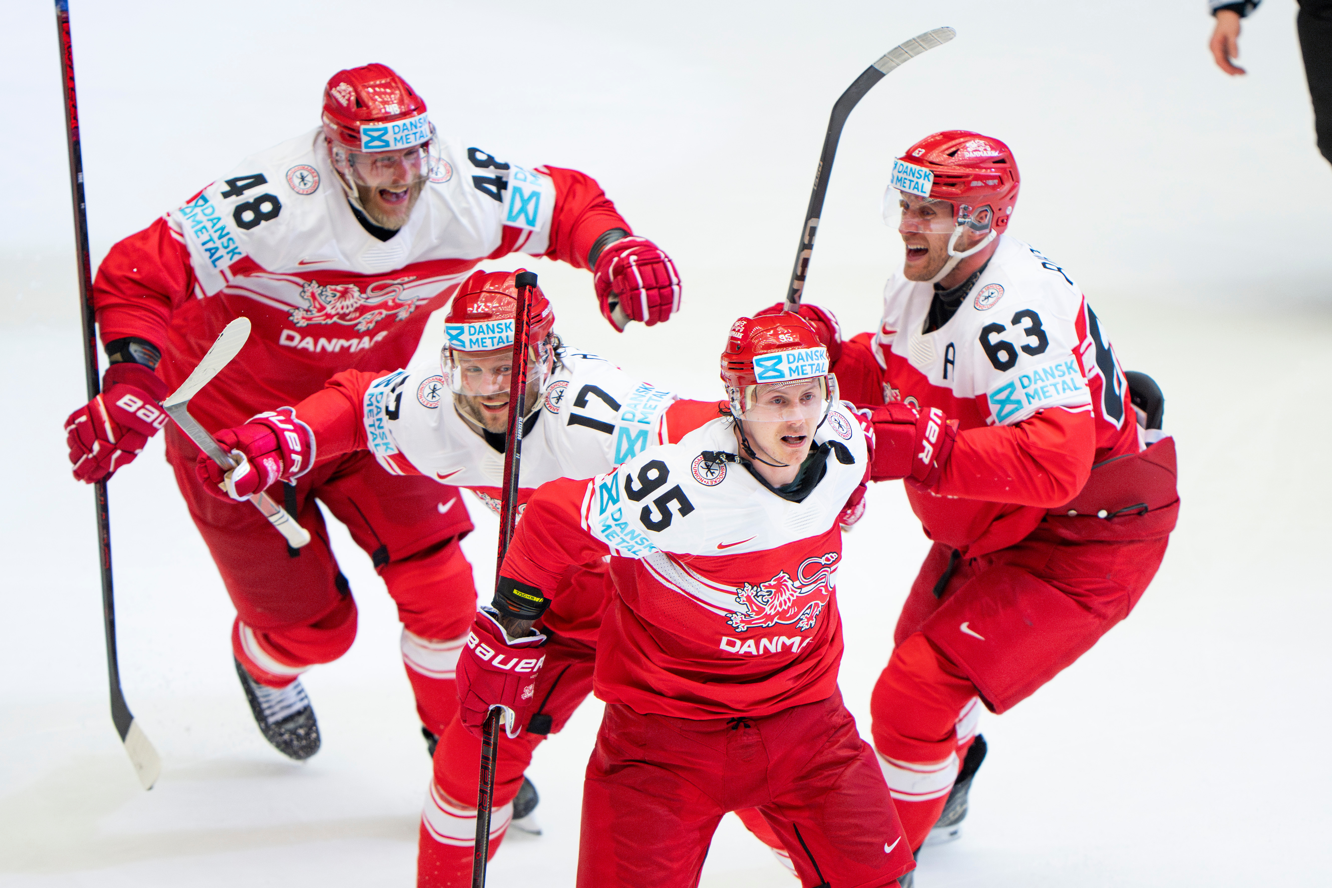 FILE - Denmark's Nick Olesen (95) celebrates with teammates after scoring the winning goal in a quarterfinal game between Canada and Denmark at the hockey world championships, May 22, 2025, in Herning, Denmark. 