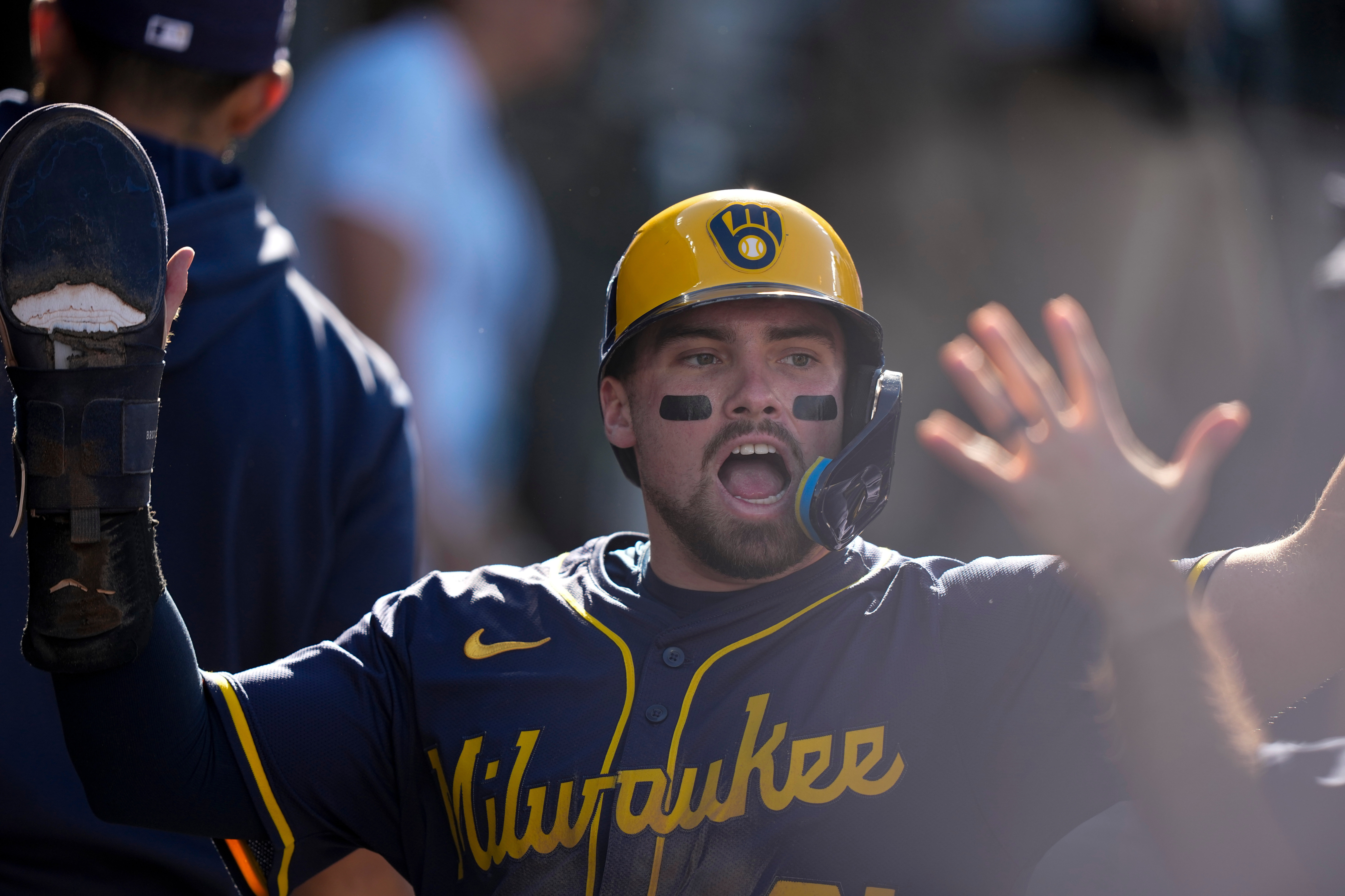 FILE - Milwaukee Brewers' Caleb Durbin celebrates after scoring against the Los Angeles Dodgers during the second inning in Game 3 of baseball's National League Championship Series, Oct. 16, 2025, in Los Angeles. 