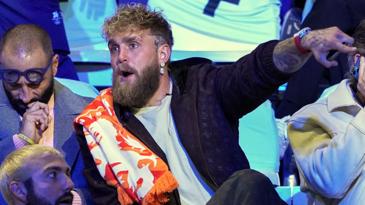 Jake Paul of the U.S., gestures as he waits to watch his fiancé Jutta Leerdam of the Netherlands compete in the women's 1,000 meters speedskating race at the 2026 Winter Olympics, in Milan, Italy, Monday, Feb. 9, 2026.