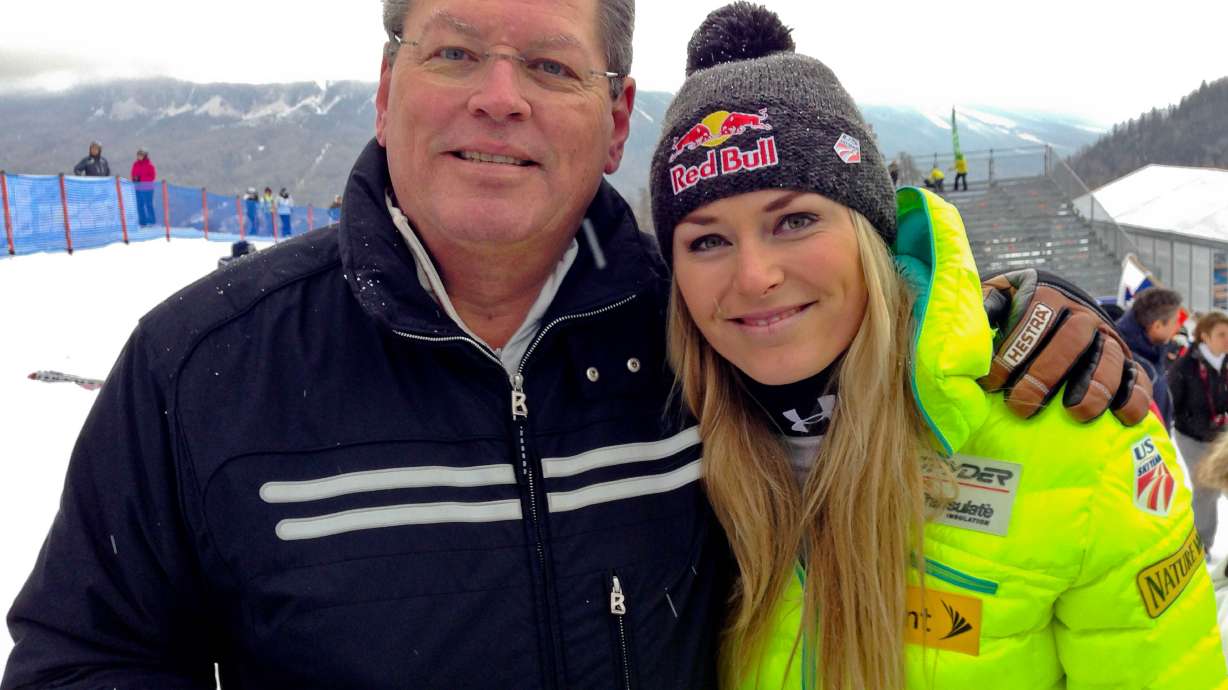 FILE - United States' Lindsey Vonn, right, poses for photographs with her father Alan Kildow at the end of an alpine ski, women's World Cup downhill race, in Cortina d'Ampezzo, Italy, Friday, Jan. 16, 2015.