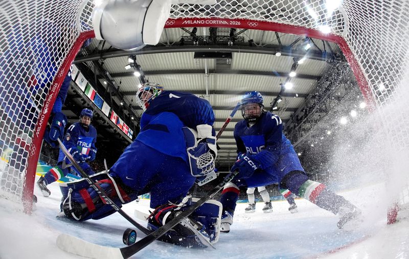 Milano Cortina 2026 Olympics - Ice Hockey - Women's Preliminary Round - Group B - Japan vs Italy - Milano Rho Ice Hockey Arena, Milan, Italy - February 09, 2026. Akane Shiga of Japan scores their second goal past Gabriella Durante of Italy and Matilde Fantin of Italy