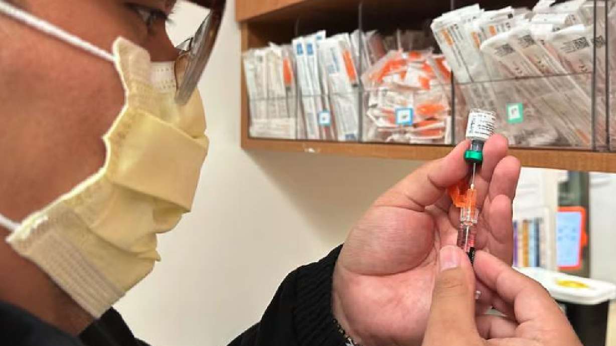 Licensed practical nurse Marco Flores prepares a patient's measles, mumps and rubella vaccine at Children's Minnesota on Nov. 20, 2025, in Minneapolis. Dr. Mehmet Oz wants Americans who have not gotten a vaccine against measles to do so.