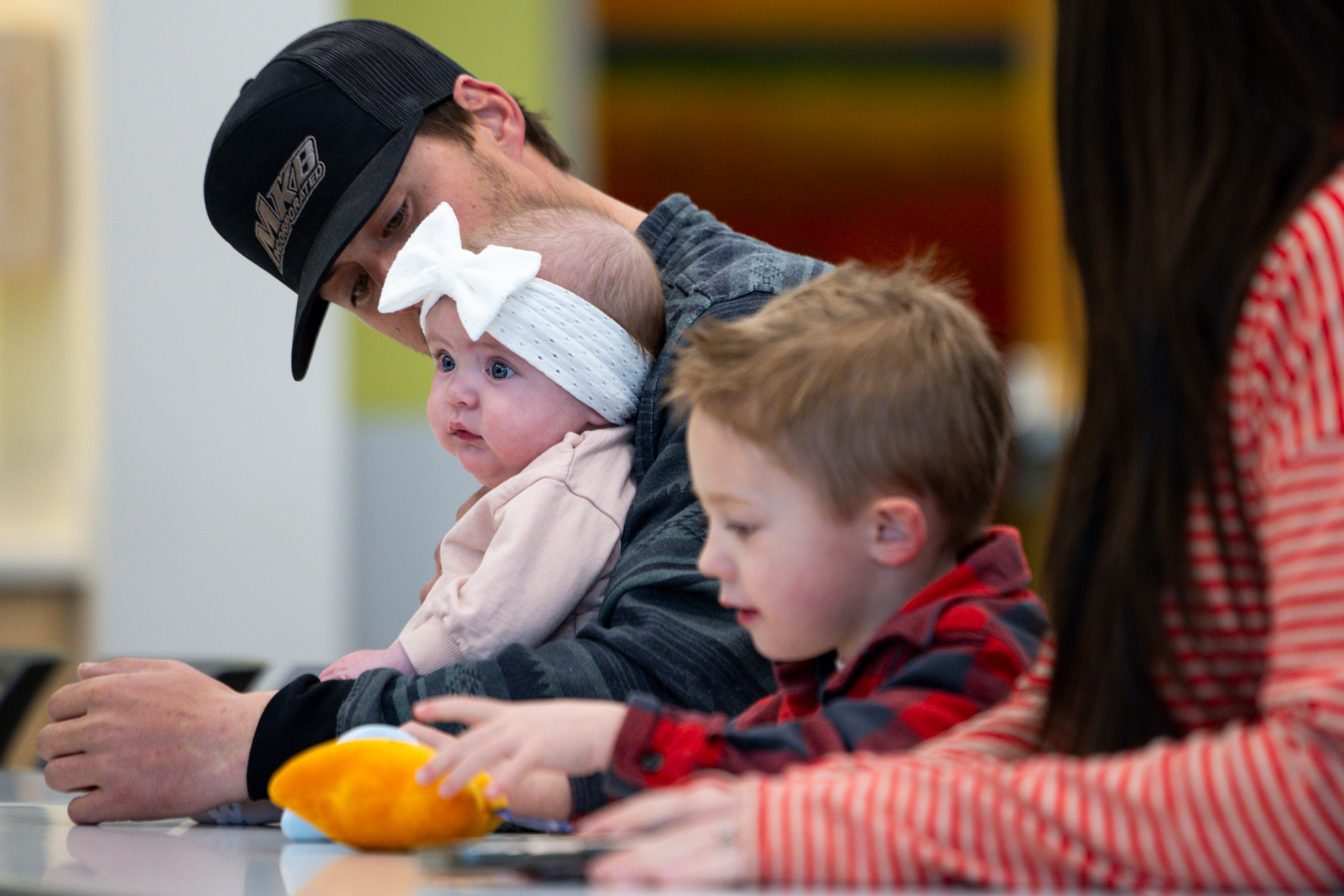 Grem Vance looks at his daughter Jaycie as they wait for the start of a media event highlighting advancements in treatment of spina bifida at Primary Children's Hospital on Monday.