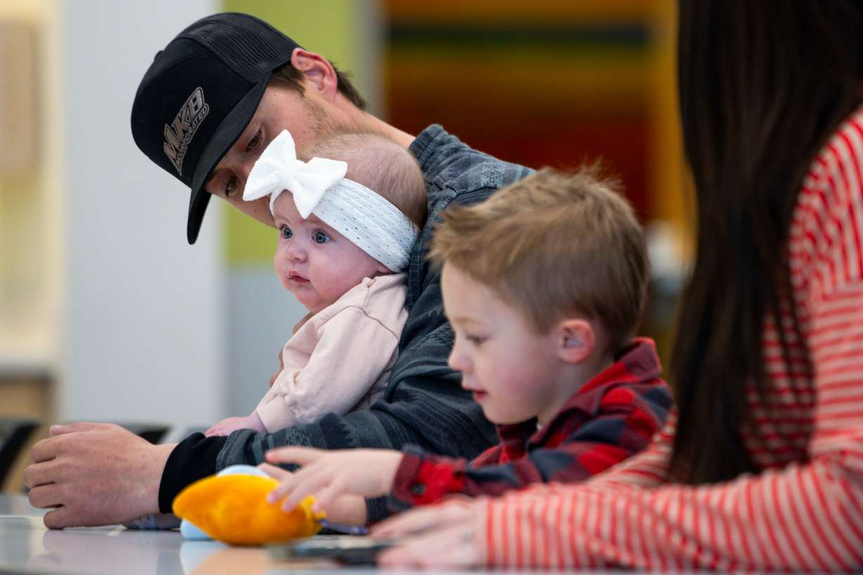 Grem Vance looks at his daughter Jaycie as they wait for the start of a media event highlighting advancements in treatment of spina bifida at Primary Children's Hospital on Monday.