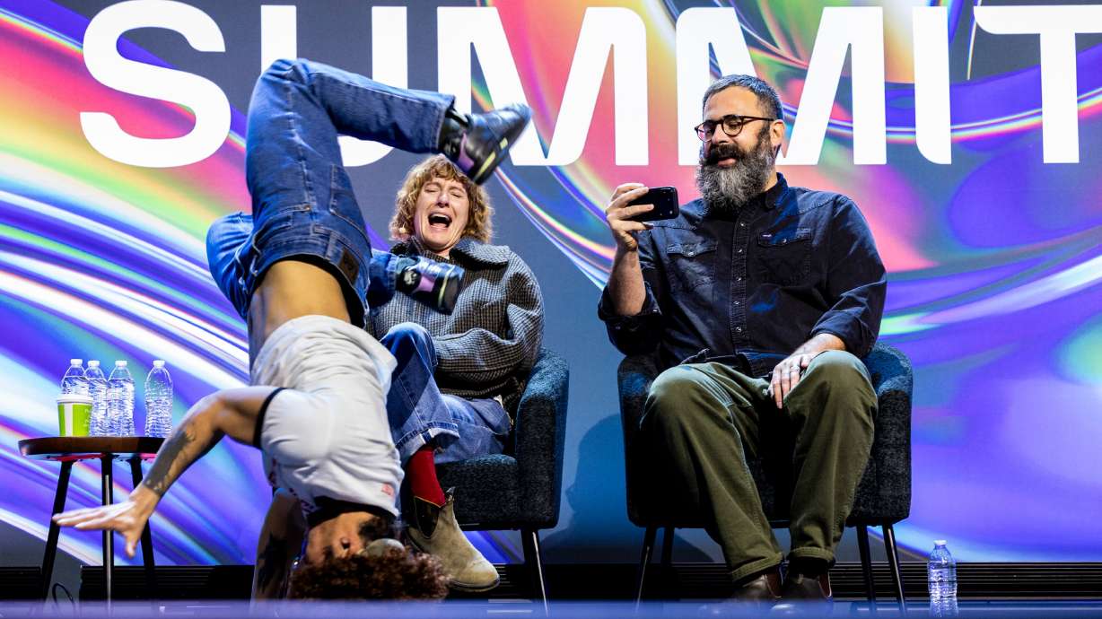 Filmmakers Jerusha and Jared Hess react while dancers dressed like “Napoleon Dynamite” reenact a scene from the movie during the Silicon Slopes Summit at the Salt Palace Convention Center in Salt Lake City on Friday.