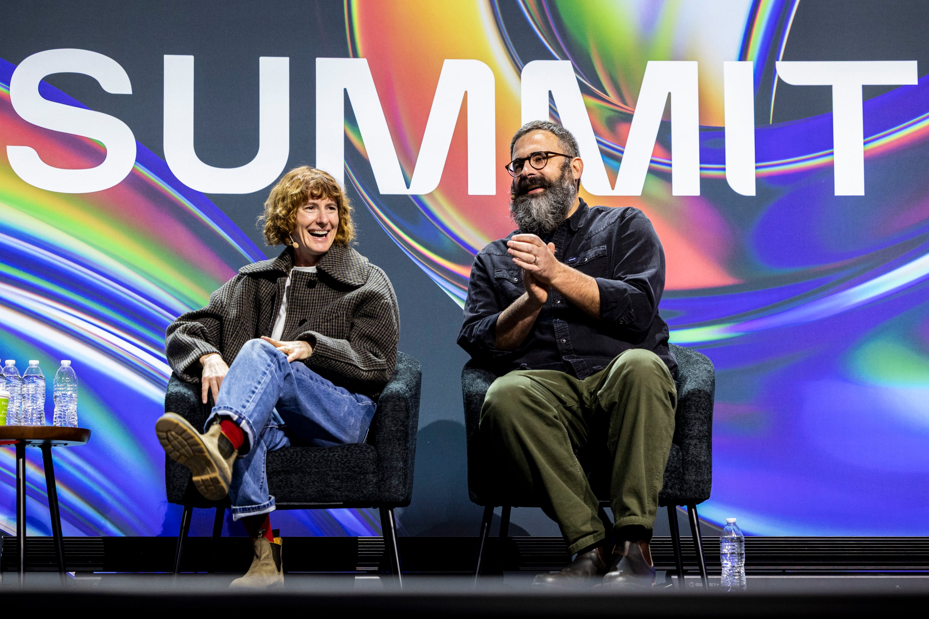 Filmmakers Jerusha and Jared Hess react after dancers dressed in the style of “Napoleon Dynamite” reenacted a scene from the movie as part of a flash mob before a moderated discussion during the Silicon Slopes Summit held at the Salt Palace Convention Center in Salt Lake City on Feb. 6.
