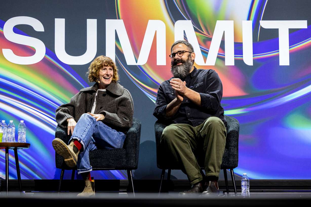 Filmmakers Jerusha and Jared Hess react after dancers dressed in the style of “Napoleon Dynamite” reenacted a scene from the movie as part of a flash mob before a moderated discussion during the Silicon Slopes Summit held at the Salt Palace Convention Center in Salt Lake City on Feb. 6.