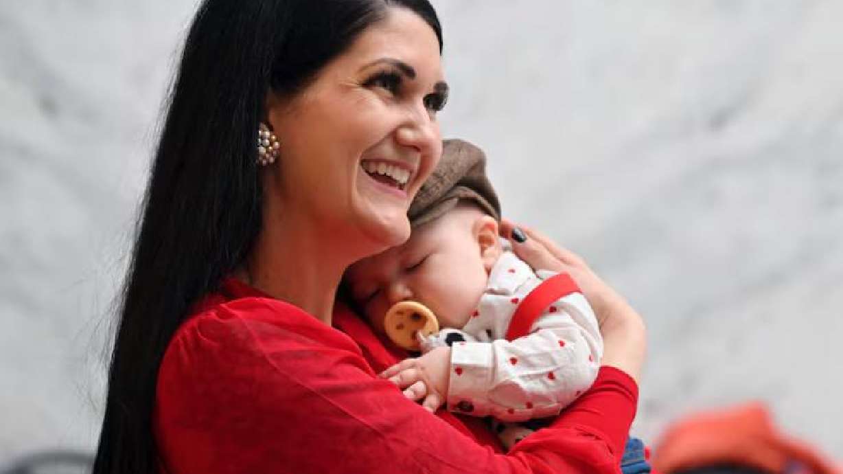Rep. Ashlee Matthews holds her 4-month-old son Joey at the Capitol on Feb. 14, 2025. This session, Sen. Stephanie Pitcher, D-Millcreek, has introduced a bill that would allow more state employees to bring their infants to work with them.
