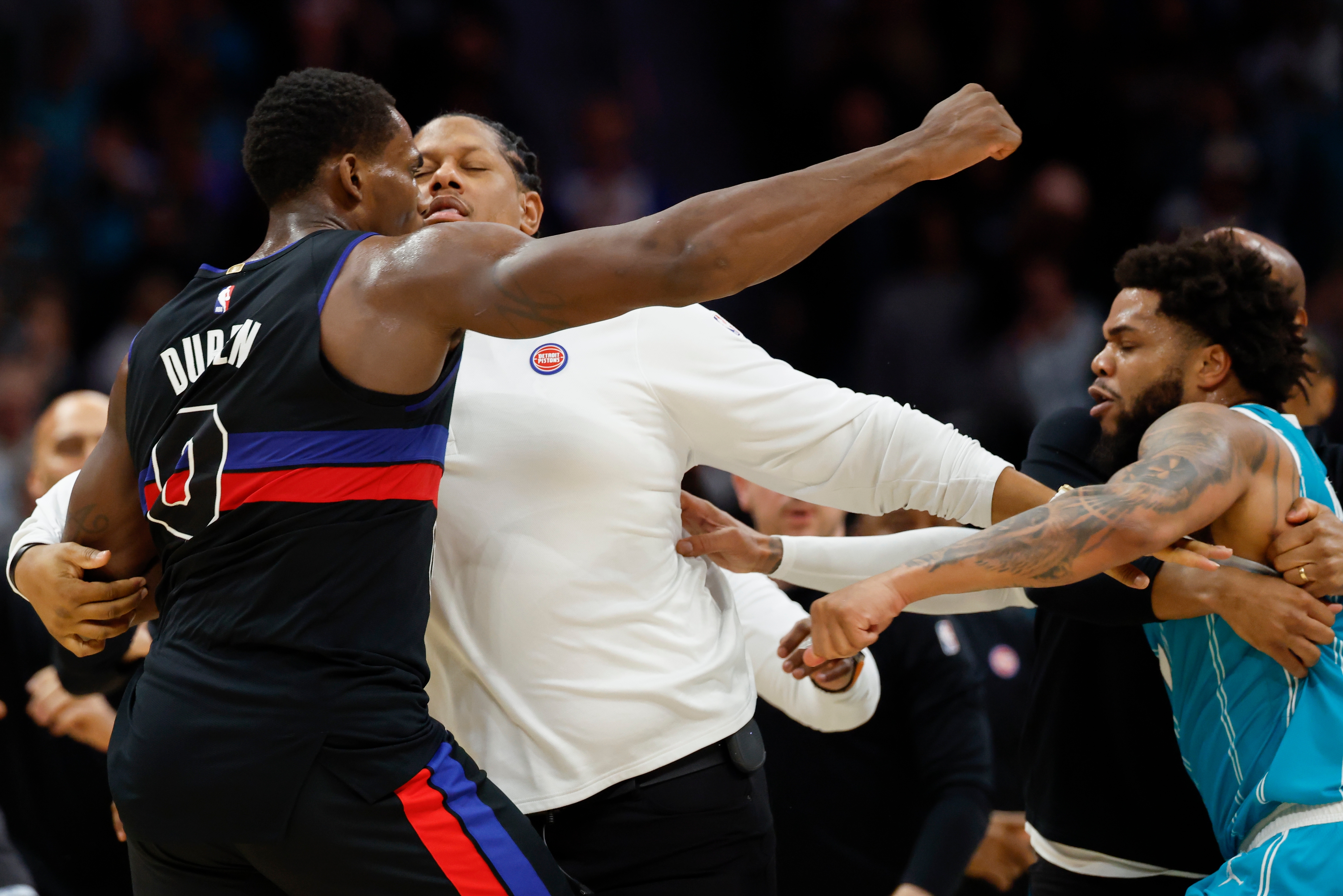 Detroit Pistons center Jalen Duren, left, throws punches with Charlotte Hornets forward Miles Bridges, right, during a fight on the court in the second half of an NBA basketball game in Charlotte, N.C., Monday, Feb. 9, 2026. 
