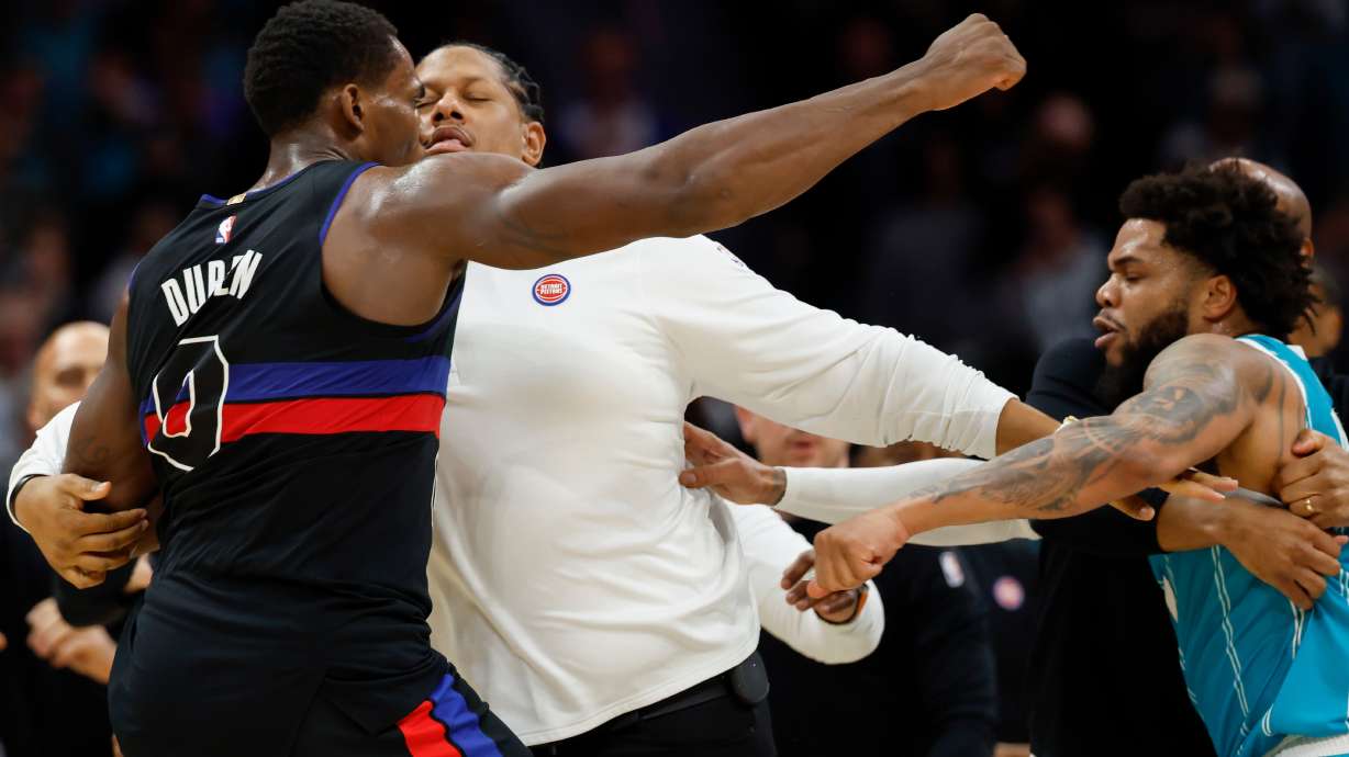 Detroit Pistons center Jalen Duren, left, throws punches with Charlotte Hornets forward Miles Bridges, right, during a fight on the court in the second half of an NBA basketball game in Charlotte, N.C., Monday, Feb. 9, 2026.