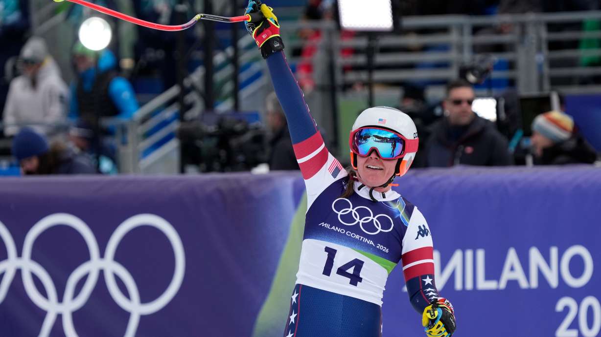 United States' Breezy Johnson celebrates at the finish area of an alpine ski, downhill portion of a women's team combined race, at the 2026 Winter Olympics, in Cortina d'Ampezzo, Italy, Tuesday, Feb. 10, 2026.