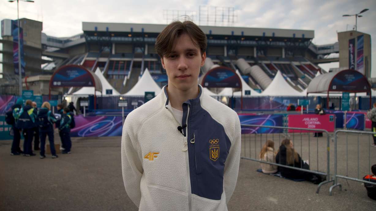 Ukrainian figure skater Kyrylo Marsak poses for a photo outside the Milan ice skating arena on his way to practice his routine, at the 2026 Winter Olympics, in Milan, Italy, Sunday, Feb. 8, 2026.