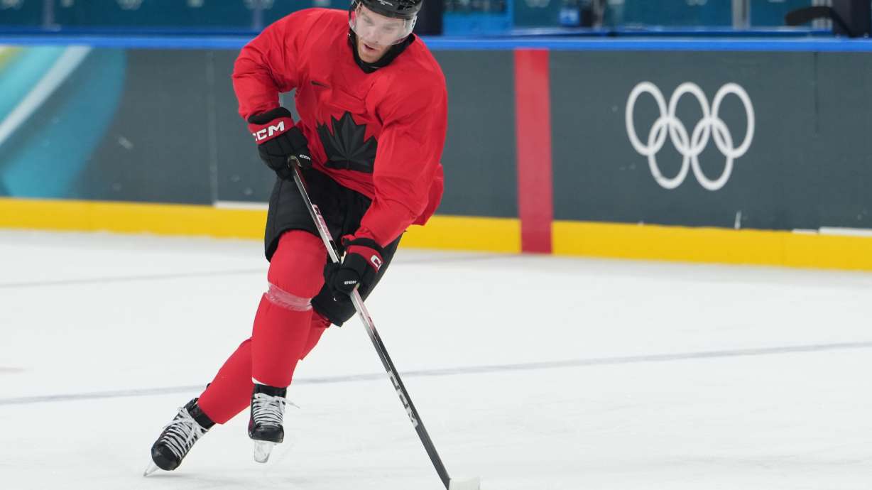 Canada's Connor McDavid skates with the puck during men's ice hockey practice at the 2026 Winter Olympics, in Milan, Italy, Sunday, Feb. 8, 2026.