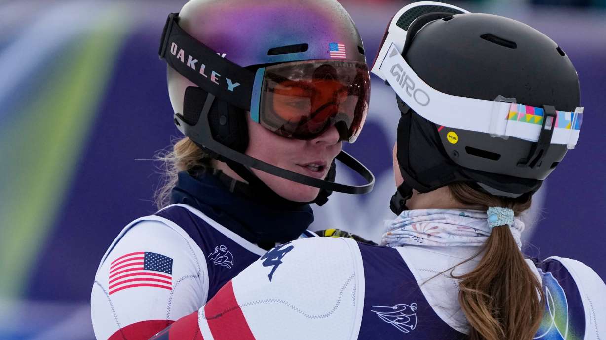 United States' Mikaela Shiffrin, left, is hugged by United States' Paula Moltzan at the finish area of an alpine ski, women's team combined race, at the 2026 Winter Olympics, in Cortina d'Ampezzo, Italy, Tuesday, Feb. 10, 2026.