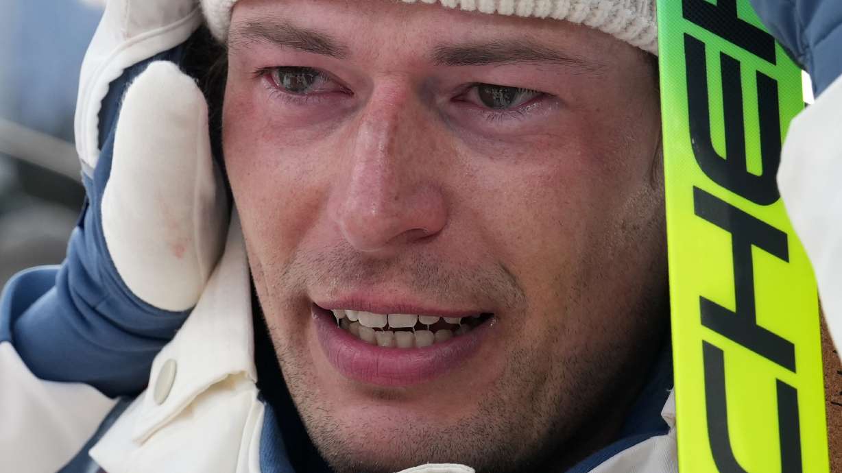 Sturla Holm Laegreid, of Norway, reacts after he won bronze in the men's 20-kilometer individual biathlon race at the 2026 Winter Olympics in Anterselva, Italy, Tuesday, Feb. 10, 2026.