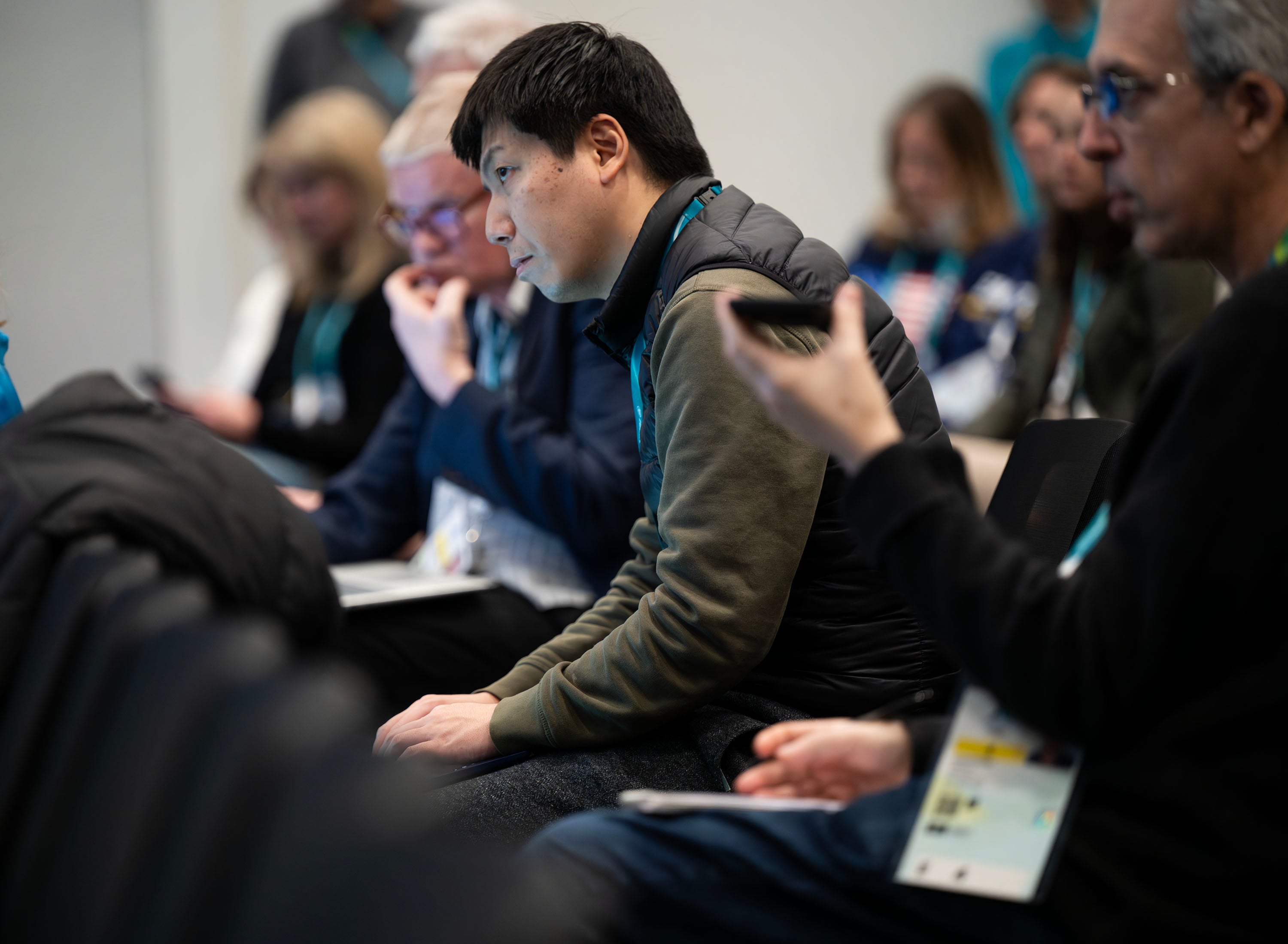 International media members listen during a press conference with 2034 Utah Winter Olympic Games organizers in the main media center for the 2026 Milan Cortina Olympics in Milan, Italy, on Tuesday. Reporters repeatedly pressed organizers on the state of politics in America.
