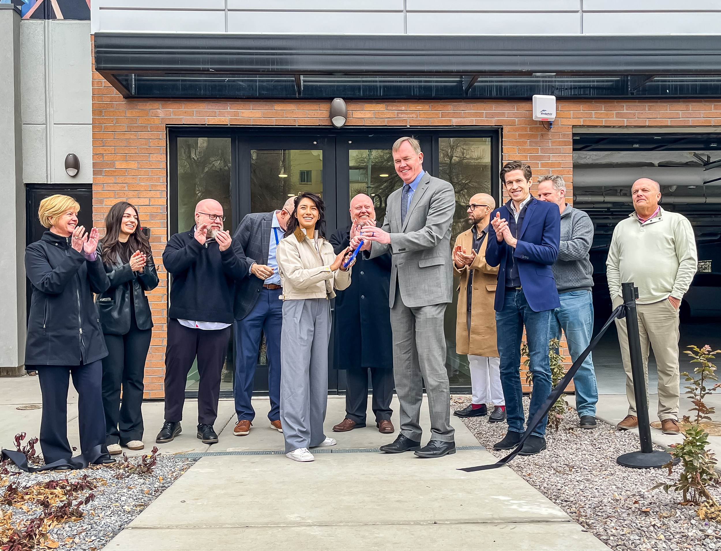 Salt Lake City Councilwoman Eva Lopez Chavez, left center, and Steve Waldrip, senior housing adviser to Gov. Spencer Cox, right center, cut a ribbon to officially open Victory Heights in Salt Lake City on Tuesday.