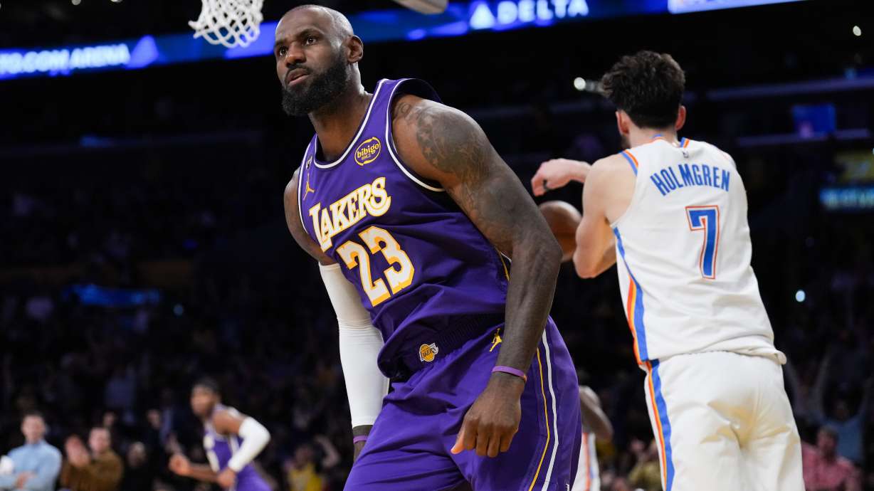 Los Angeles Lakers forward LeBron James (23) reacts after making a dunk during the first half of an NBA basketball game against the Oklahoma City Thunder Monday, Feb. 9, 2026, in Los Angeles.