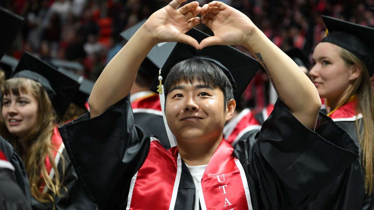 A graduate gestures to the audience as they file out after commencement at the University of Utah in Salt Lake City on May 2, 2024. The Beehive State came in at No. 11 in a recent report on the most- and least-educated states.