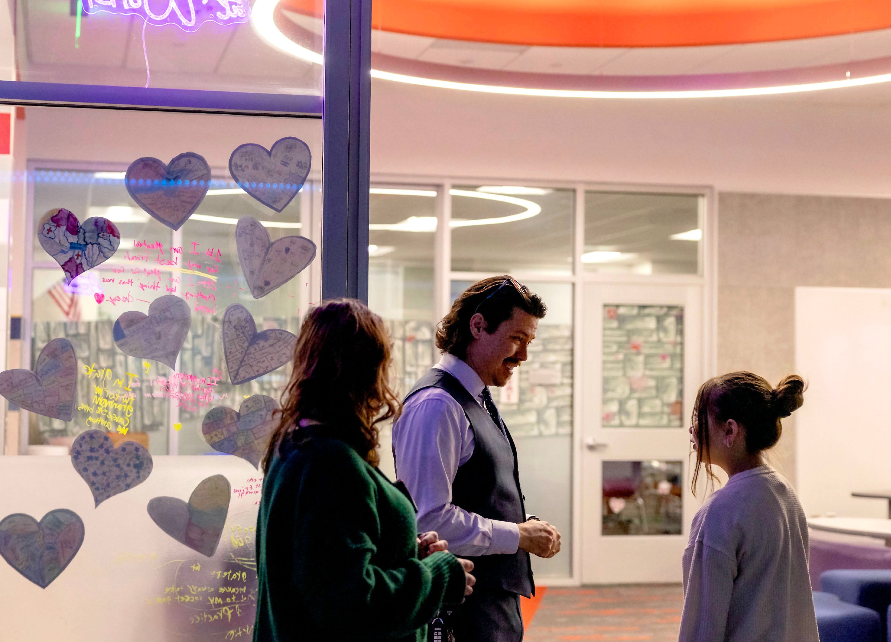 Rep. John Arthur, D-Holladay, speaks with a student at Meadowlark Elementary School in Salt Lake City on Jan. 29.
