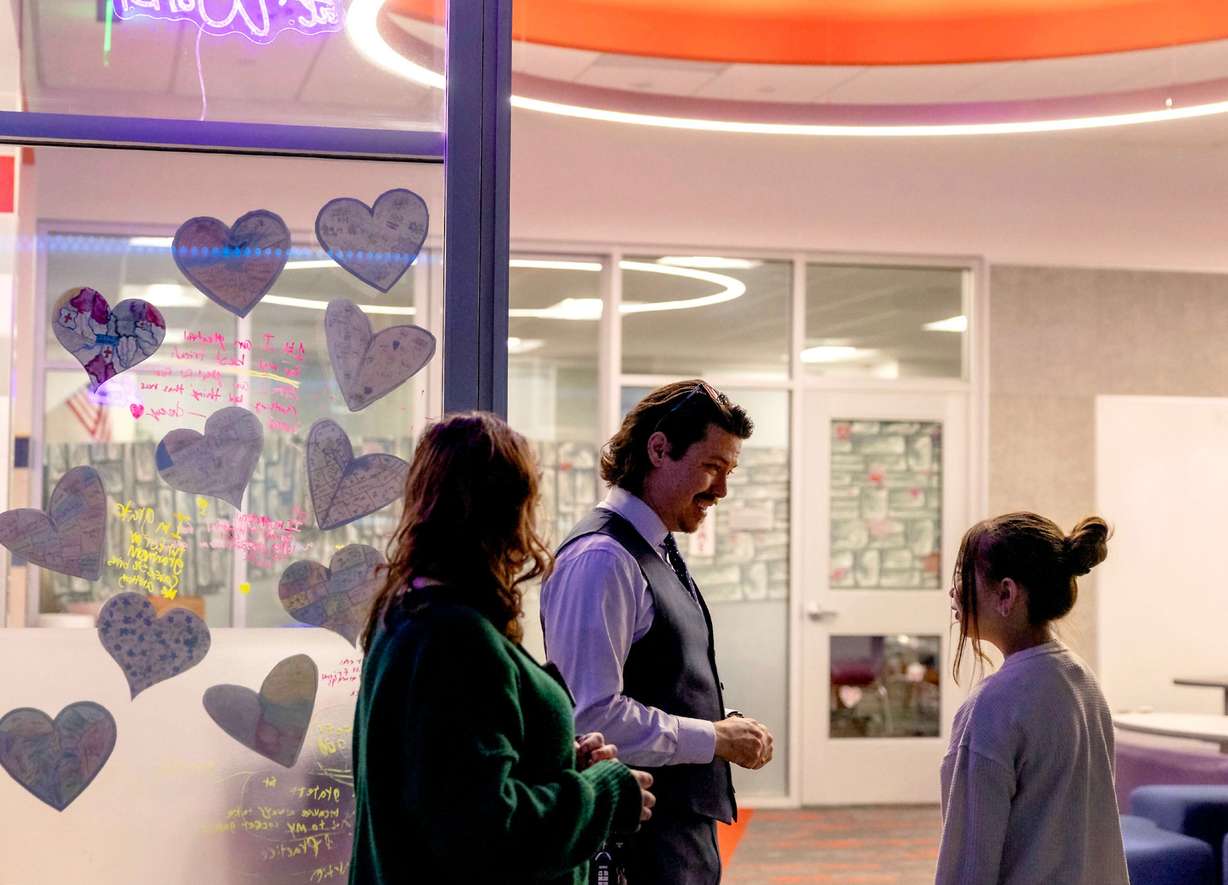 Rep. John Arthur, D-Holladay, speaks with a student at Meadowlark Elementary School in Salt Lake City on Jan. 29.