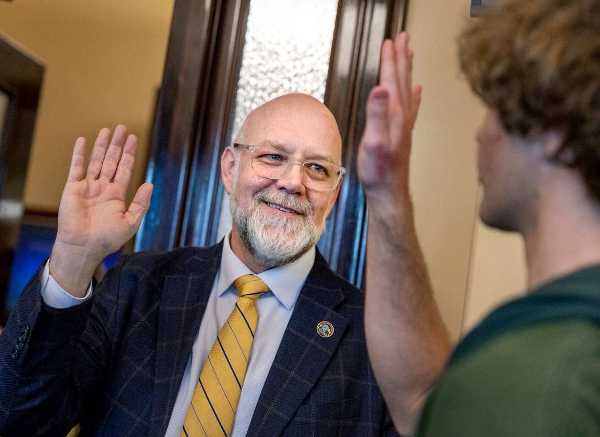 Rep. Doug Welton, R-Payson, a Salem Hills High School teacher, says goodbye to debate team members following a discussion with House Speaker Mike Schultz, R-Hooper, at the Capitol in Salt Lake City on Jan. 28.