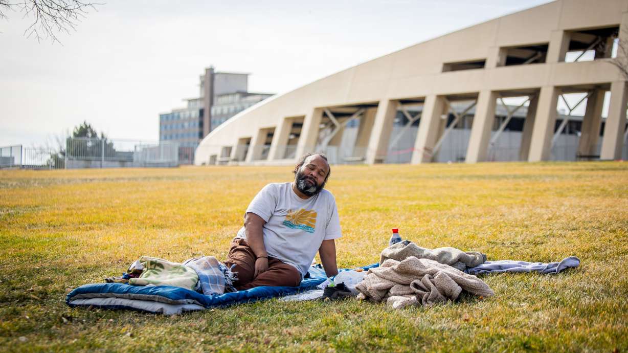Jacob Myra Omar sits outside the Salt Lake City Main Library on Feb. 3. Utah leaders said Tuesday that overall homelessness in Utah decreased by 1.6% from 2025 to 2026.