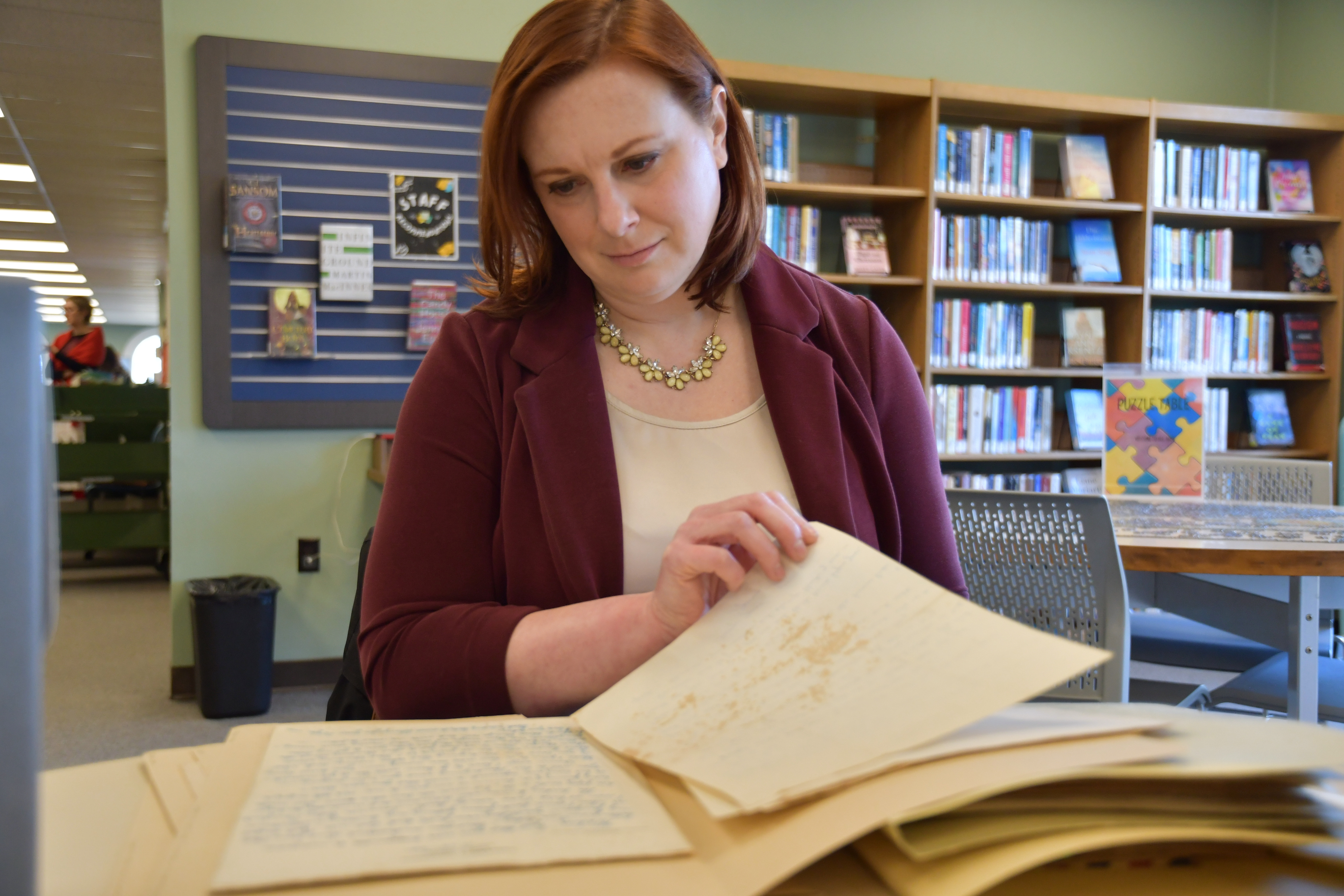 Archivist Kelley Sirko looks at love letters between a Black soldier and his wife during World War II that are part of a digital exhibit on Monday in Nashville, Tenn. The letters were turned over to the library from the Nashville Public Archives.