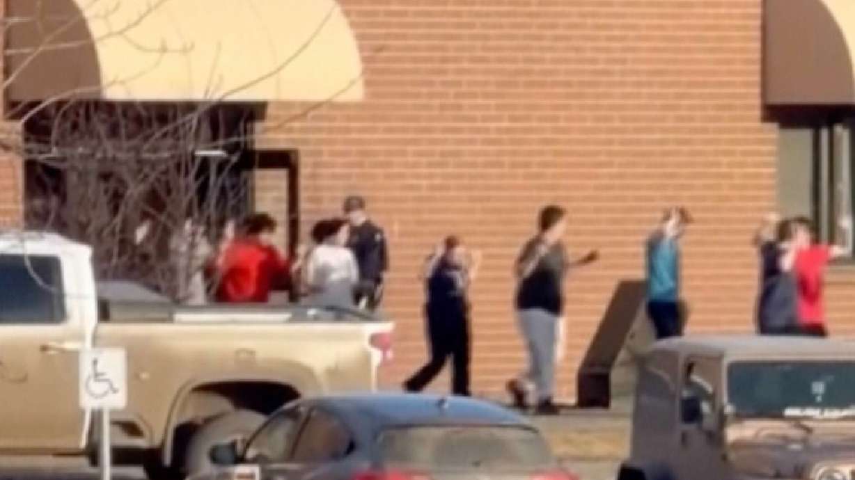 Students exit the Tumbler Ridge Secondary School after deadly shootings in British Columbia, Canada, on Tuesday.