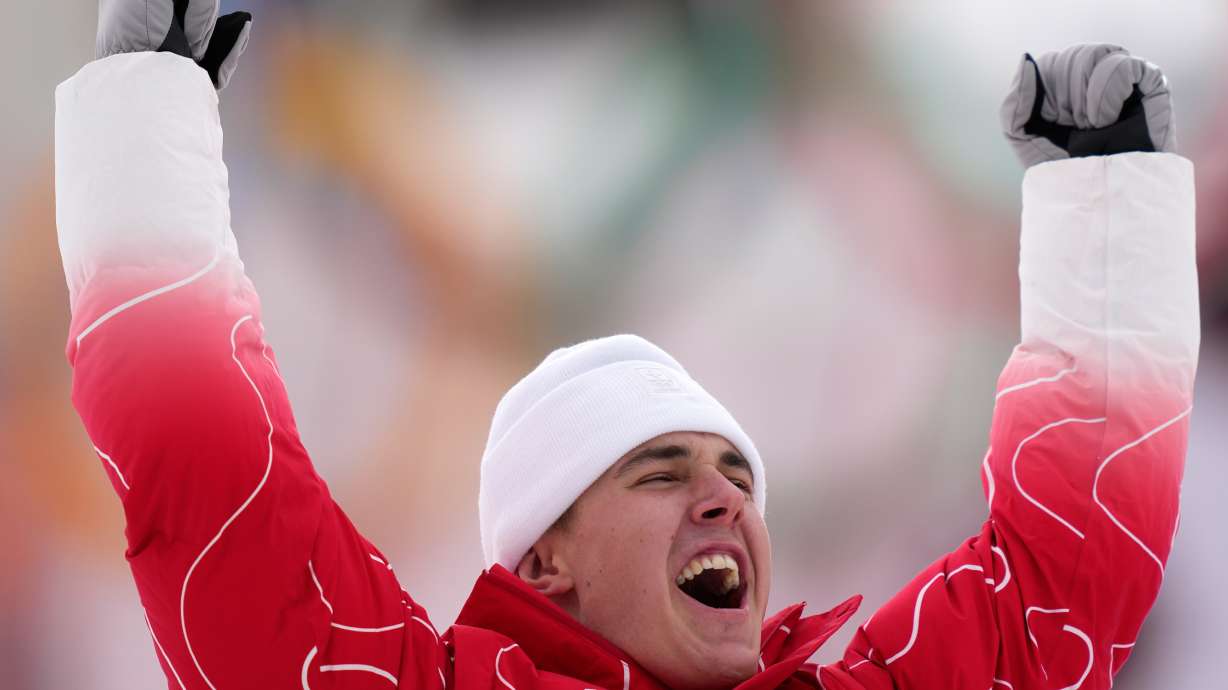 Switzerland's Franjo von Allmen celebrates winning the gold medal in a men's super-G race, at the 2026 Winter Olympics, in Bormio, Italy, Wednesday, Feb.11, 2026.