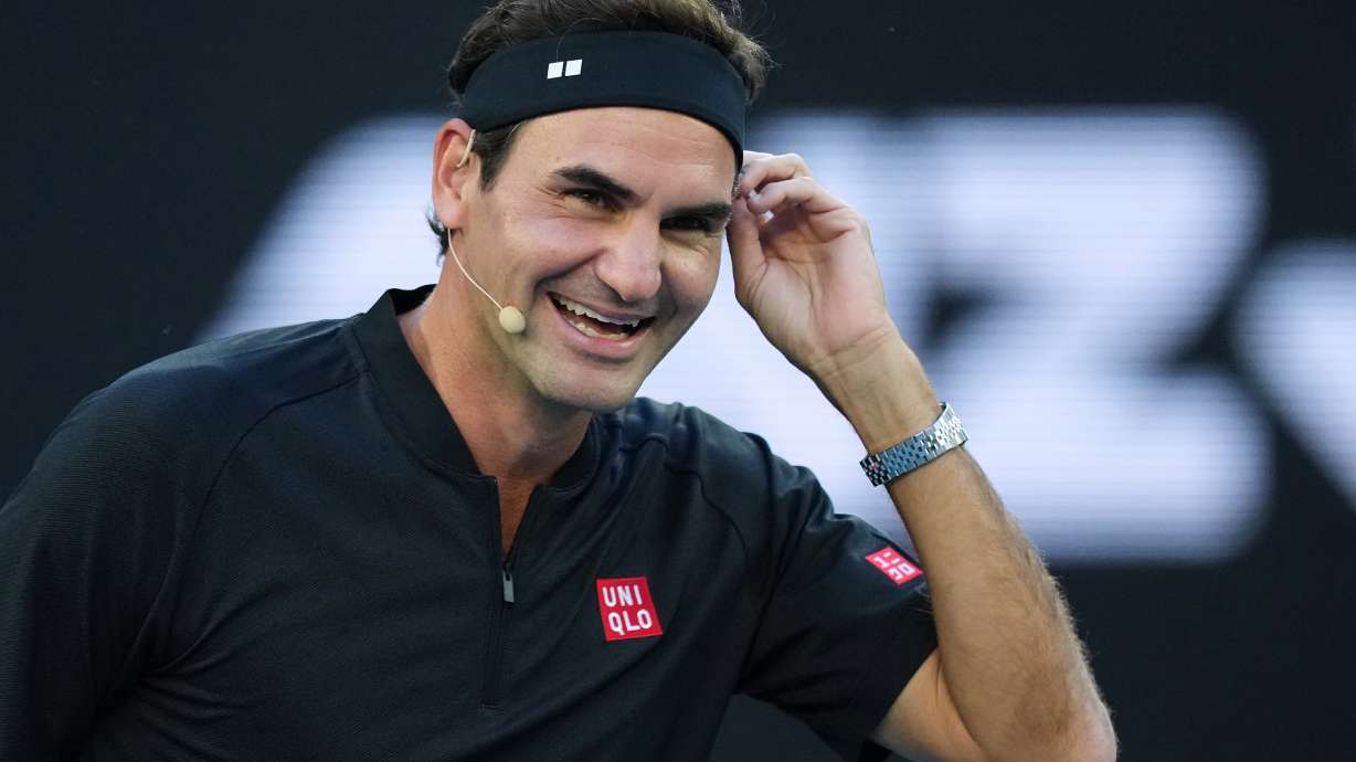 FILE - Roger Federer of Switzerland reacts with partner Andre Agassi of the United States in their doubles match against Lleyton Hewitt and Pat Rafter of Australia during the Opening Ceremony for the Australian Open tennis championship in Melbourne, Australia, Jan. 17, 2026.