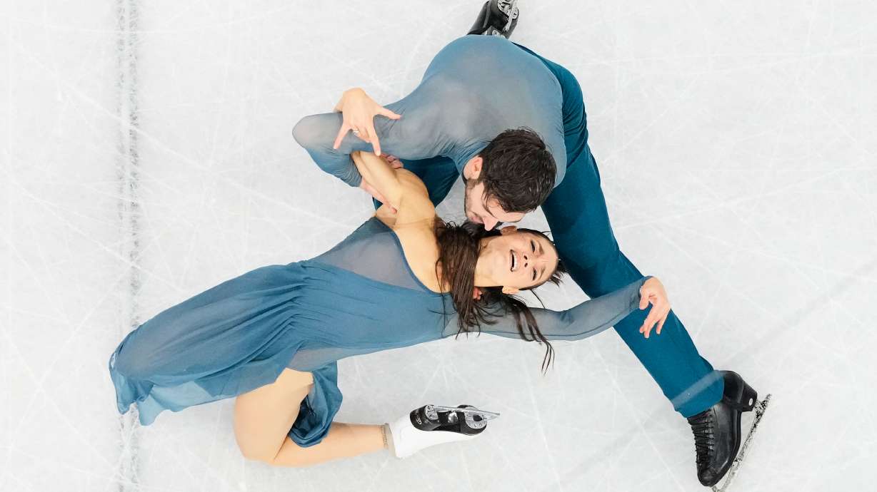 Laurence Fournier Beaudry and Guillaume Cizeron of France compete during the ice dancing free skate in figure skating at the 2026 Winter Olympics, in Milan, Italy, Wednesday, Feb. 11, 2026.