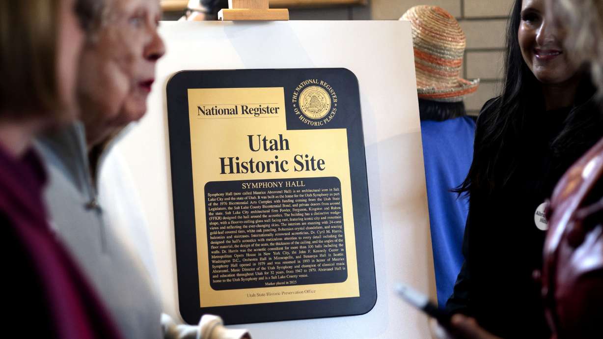 Carolyn Abravanel, wife of Maurice Abravanel, left, speaks with attendees at a ceremony celebrating Abravanel Hall becoming a historic site in Salt Lake City on Wednesday.