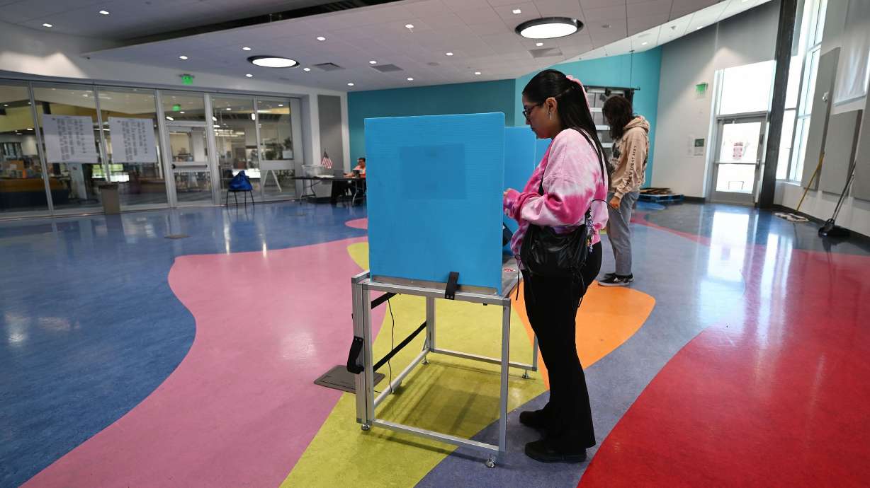 Jennifer Yebra, of Kearns, and Trey Wolsey, of West Valley City, vote in Kearns on Nov. 4, 2025. Republicans narrowly advanced their hotly debated voter ID legislation on Wednesday, marking the second time the proof-of-citizenship legislation has passed the lower chamber in the last year.