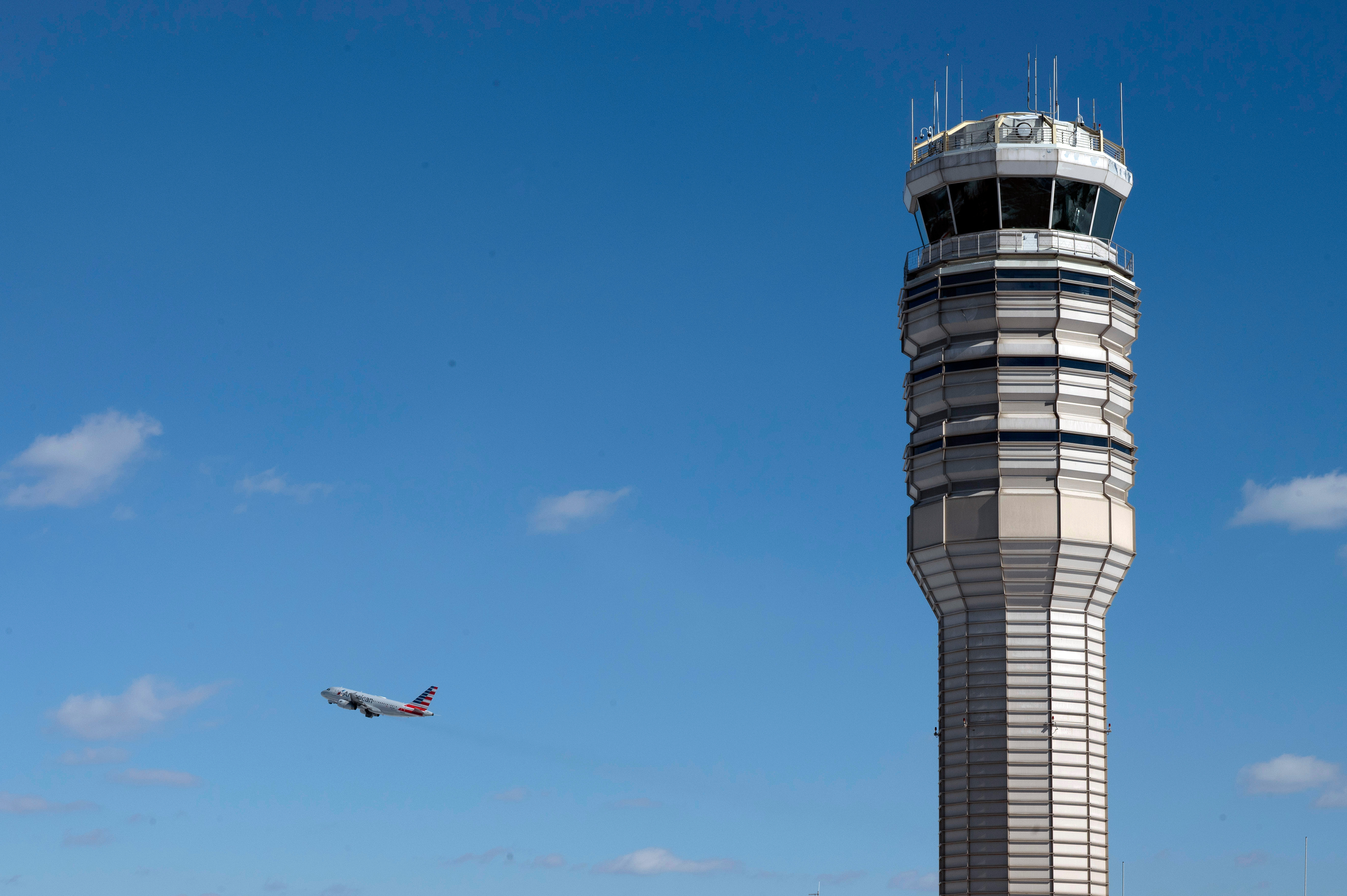 An airplane takes off behind the control tower at Ronald Reagan Washington National Airport, on the anniversary of the Potomac River mid-air collision between an American Airlines passenger plane and an Army Blackhawk helicopter, Thursday, Jan. 29, 2026, in Arlington, Va. 