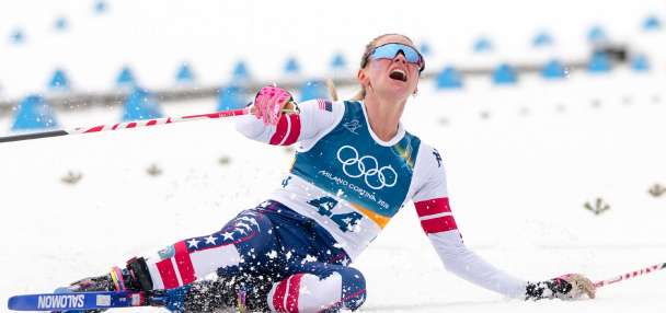 Jessie Diggins fights injury to take bronze in race dominated by Sweden at Milan Cortina Games