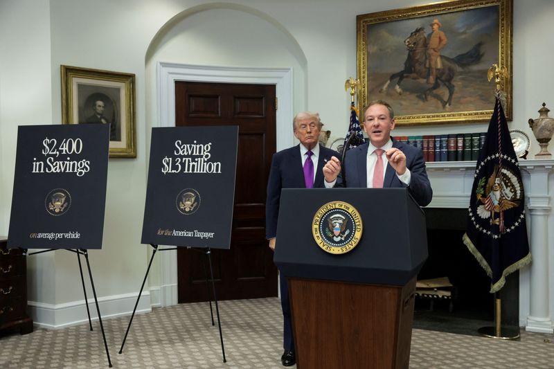 Environmental Protection Agency Administrator Lee Zeldin speaks, accompanied by President Donald Trump, at the White House in Washington, Thursday. The Trump administration repealed an Obama-era endangerment finding on climate change, which Zeldin called "the holy grail of ⁠federal regulatory overreach."