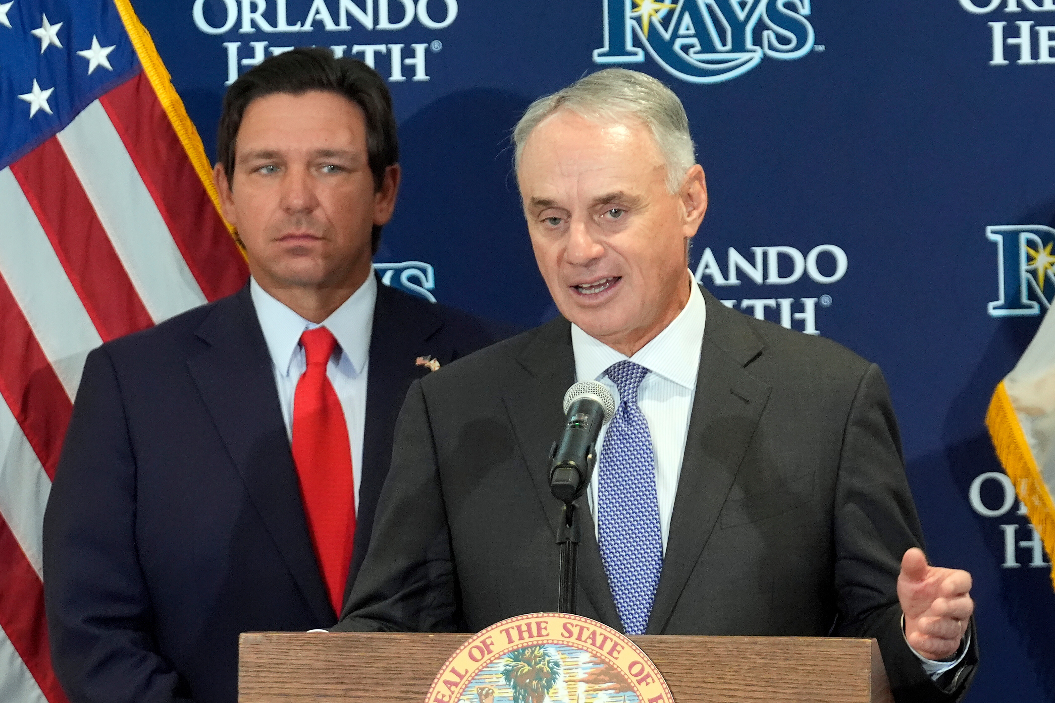 Major League Baseball commissioner Rob Manfred, right, speaks during a new baseball stadium news conference as Florida Gov. Ron DeSantis looks, Tuesday, Feb. 3, 2026, at Hillsborough College in Tampa, Fla. 