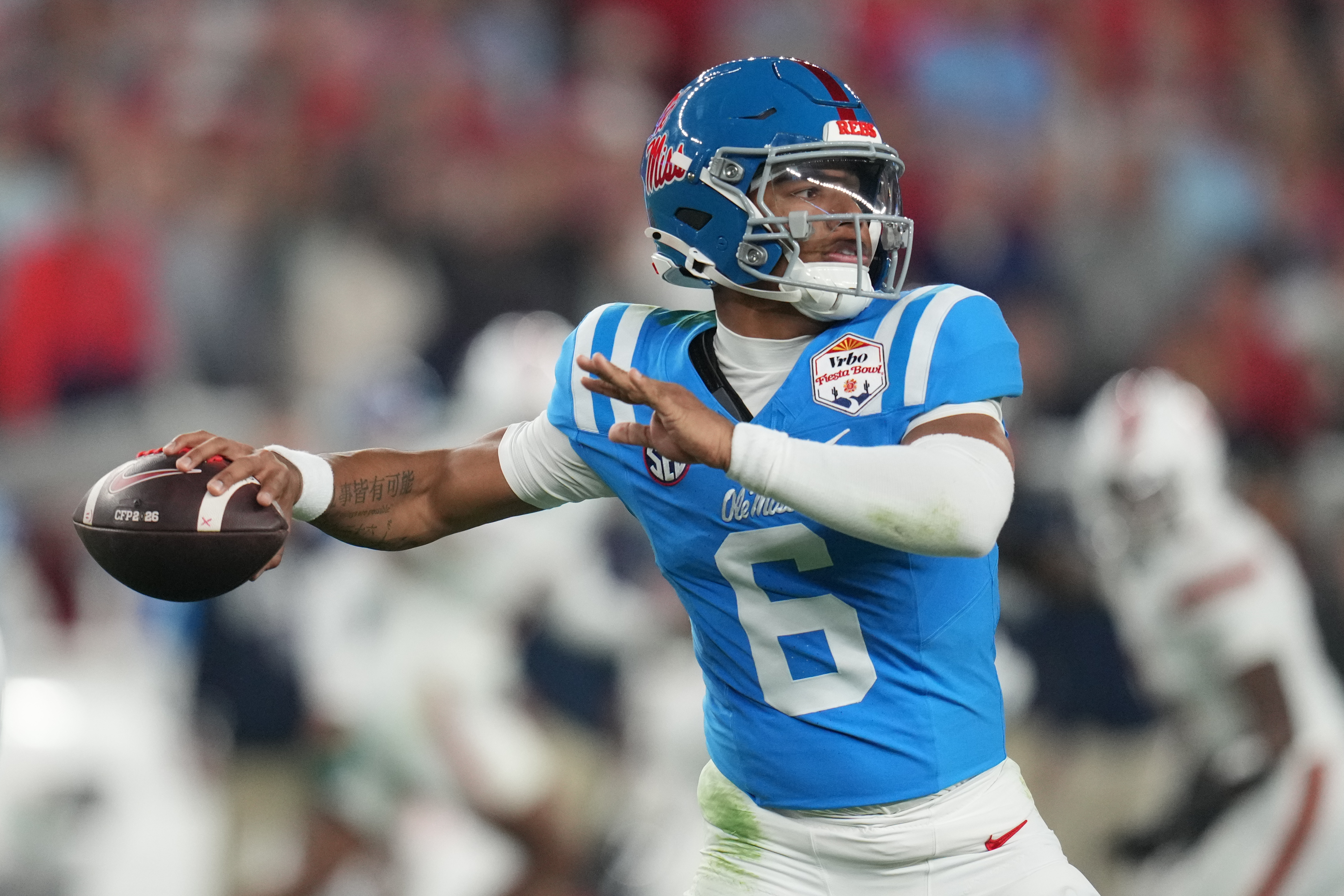 FILE - Mississippi quarterback Trinidad Chambliss throws during the first half of the Fiesta Bowl NCAA college football playoff semifinal game against Miami, Jan. 8, 2026, in Glendale, Ariz. 